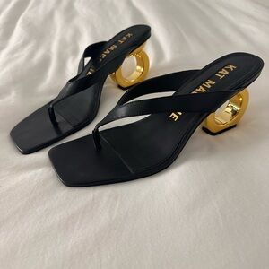 Elegant Black and Gold Heels by Kat Maconie